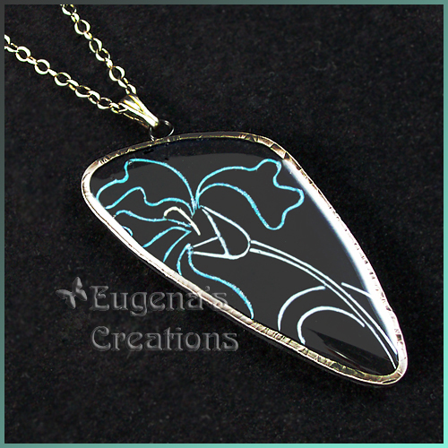 One-of-a-kind polymer clay and resin pendant with sterling silver bezel and iris design
