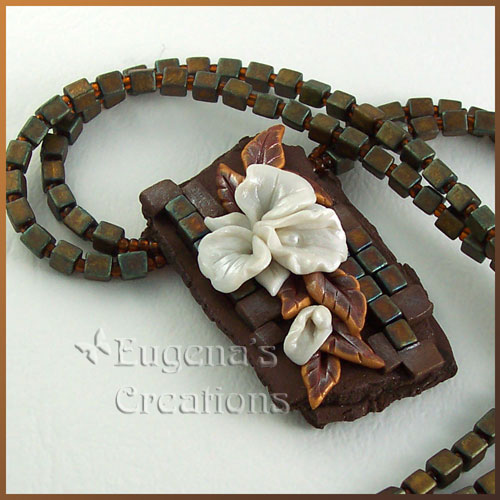 One-of-a-kind necklace with white hand-sculpted orchids