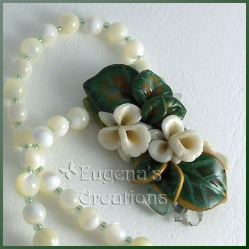 One-of-a-kind necklace with white hand-sculpted orchids