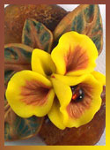 One-of-a-kind pendant with amber and hand-sculpted orchid