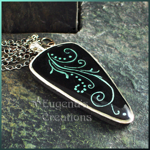 One-of-a-kind polymer clay and resin pendant with sterling silver bezel and swirl design